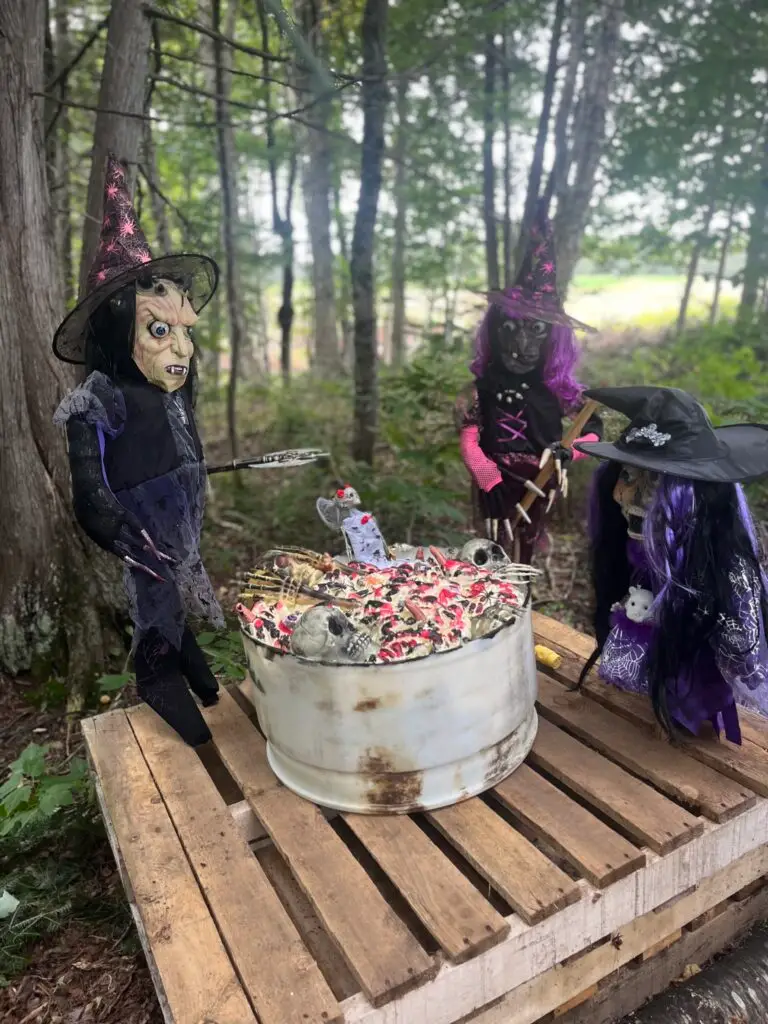 a group of dolls in clothing outside